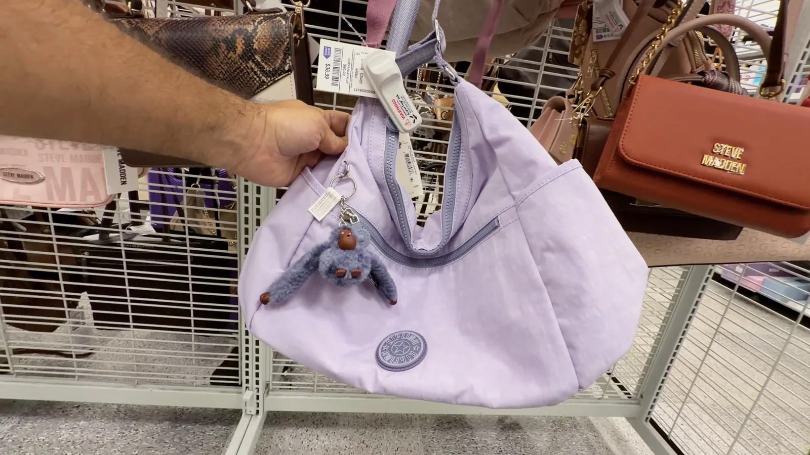 Cartera Kipling lila con su llavero de mono